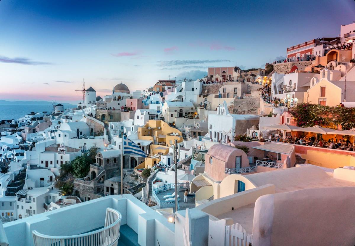 White villages on the cliffs of Santorini at sunset