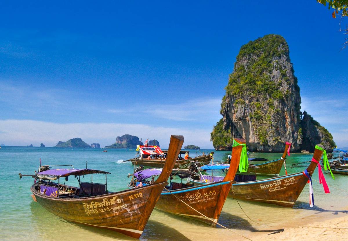 Longtail boats on a beach in Krabi, Thailand